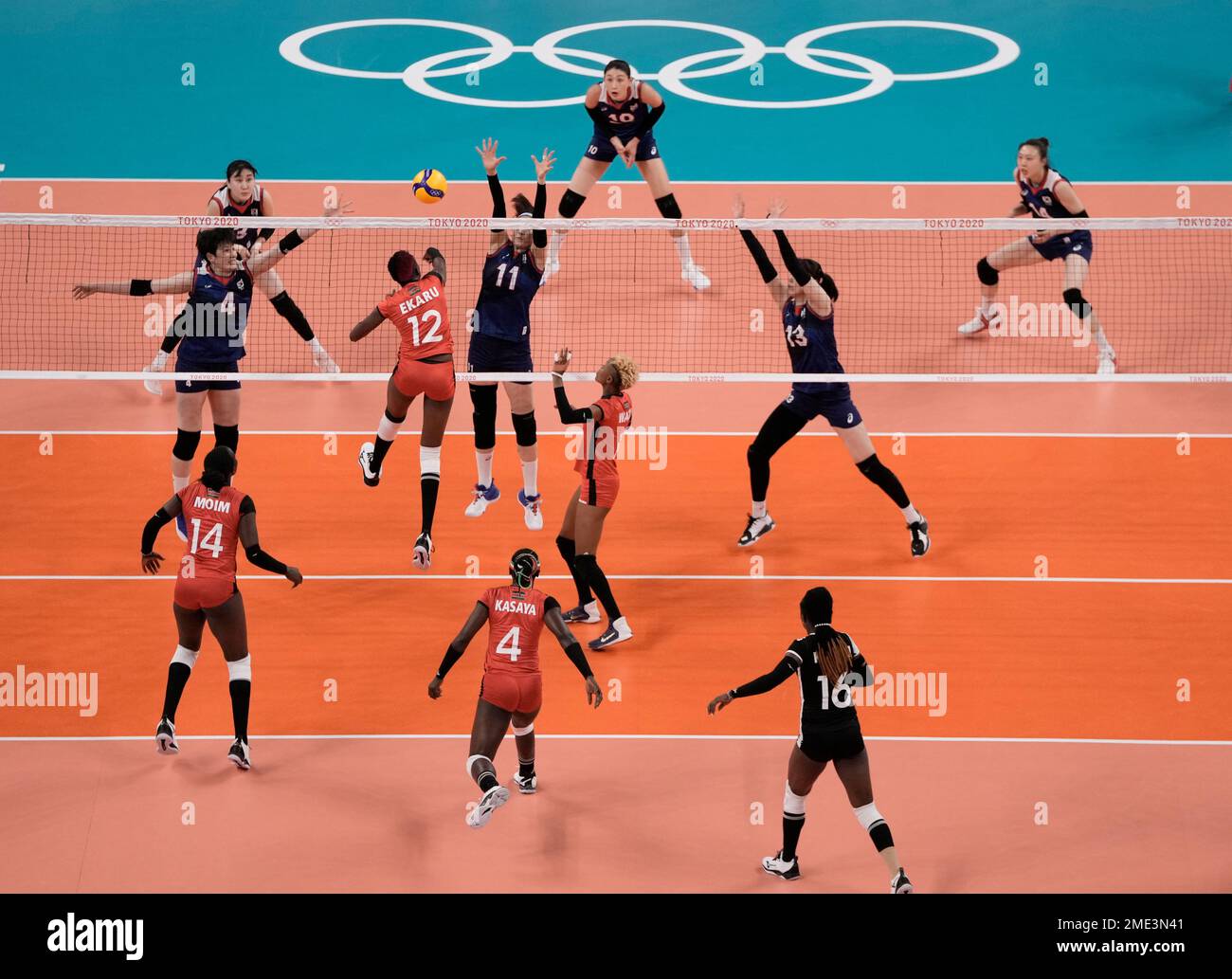 Kenya's Gladys Ekaru Emaniman spikes a ball during a women's volleyball