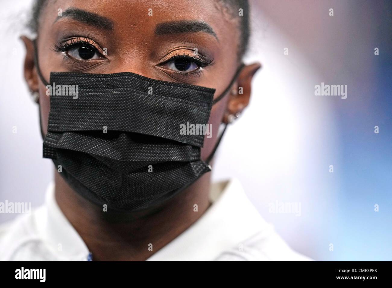 Simone Biles, Of The United States, Stands Wearing A Mask After She ...