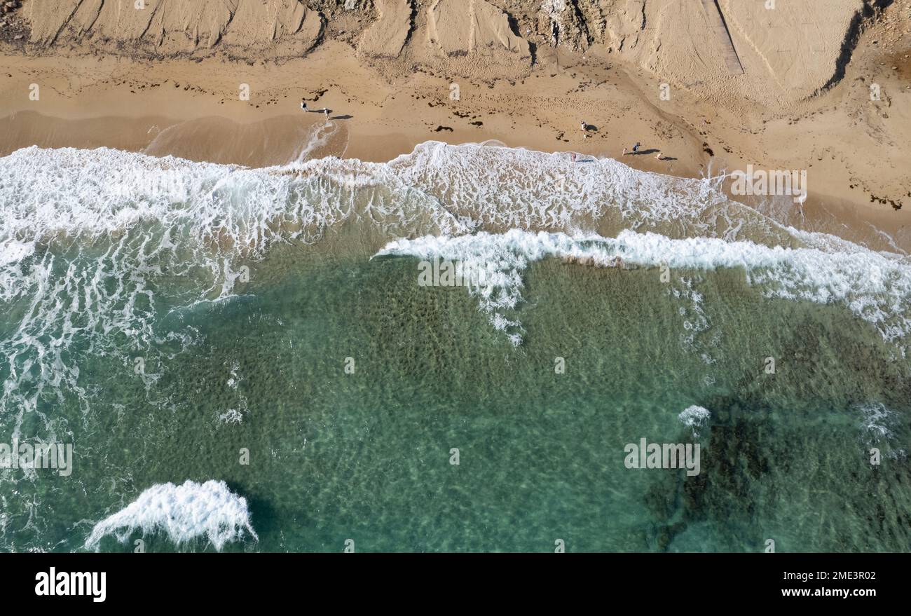 Aerial view of ocean waves breaking on a sandy beach. Nature background, Protaras Cyprus Stock Photo
