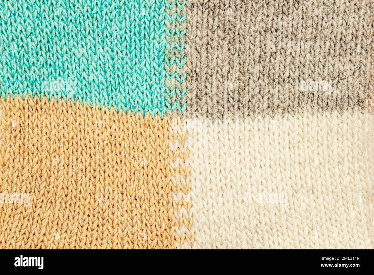 Knitted background, loops closeup. Hand knitting with woolen yarn. Woolen knitting pattern, warm sweater, copy space Stock Photo
