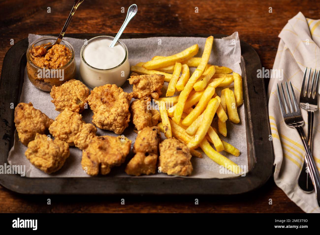 Cauliflower wings food. Cauliflower pieces and french fries with vegan