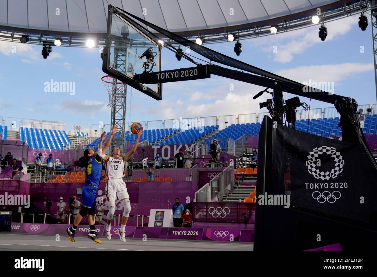 France's Laetitia Guapo (12) heads to the basket past Romania's Sonia