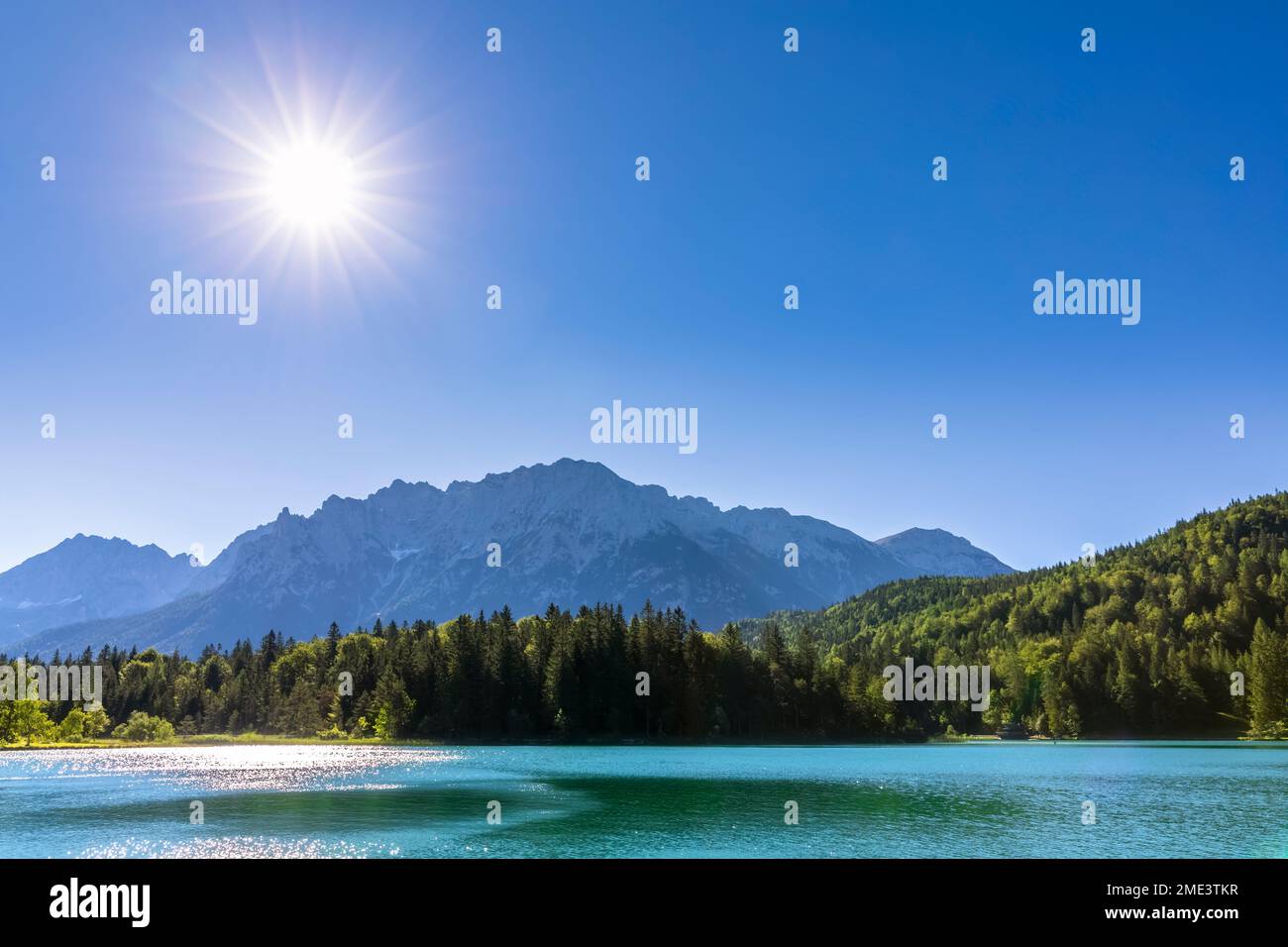 Germany, Bavaria, Summer sun shining over Lautersee Stock Photo