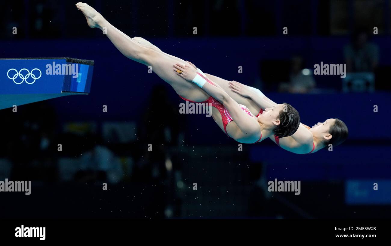 Yuxi Chen and Jiaqi Zhang of China compete during the women's ...