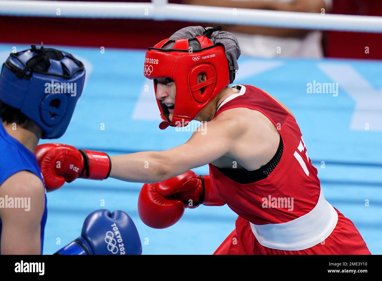 Italy's Angela Carini, right, punches NienChin Chen, of Chinese Taipei