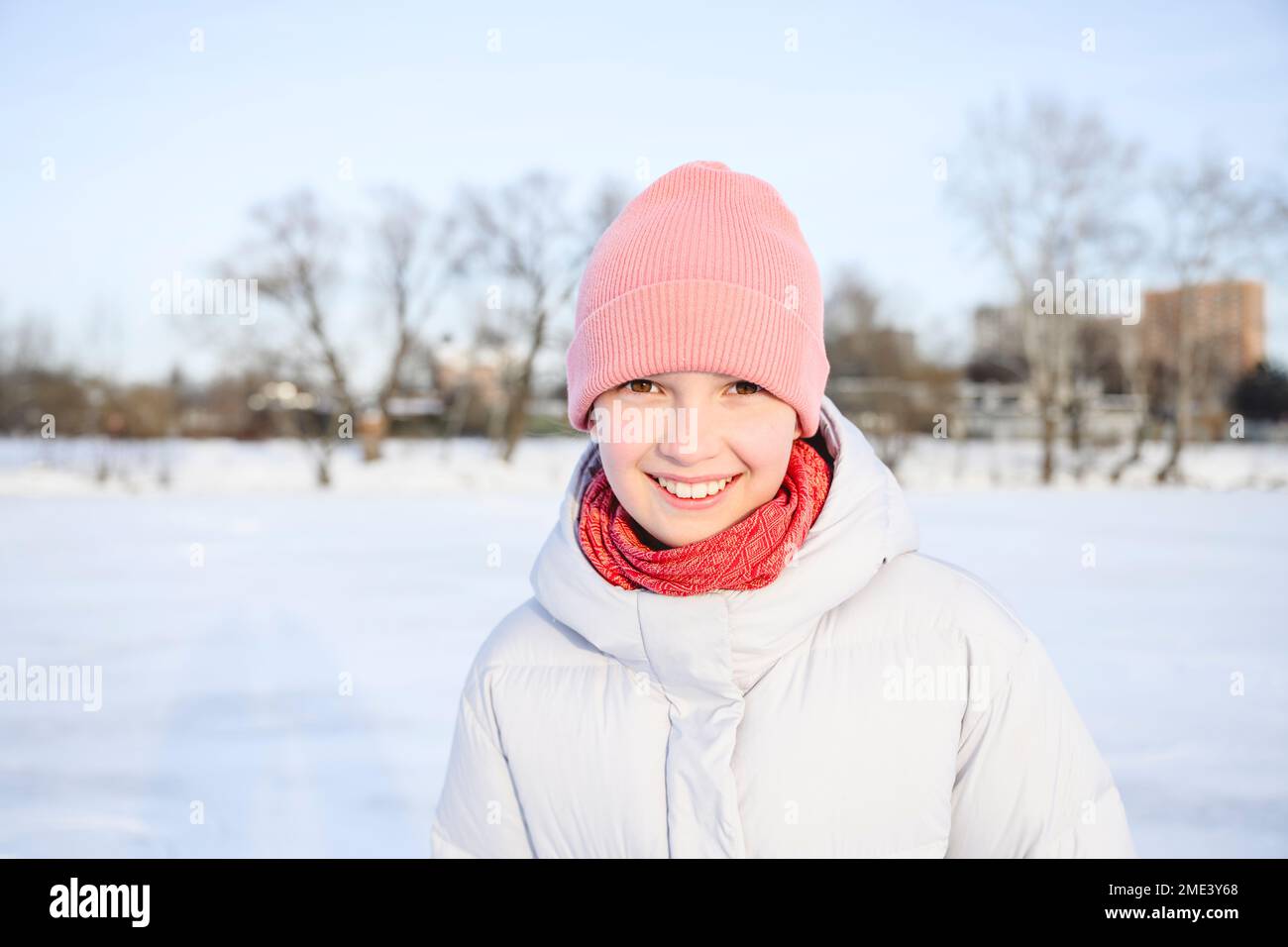 Happy girl wearing knit hat in winter Stock Photo
