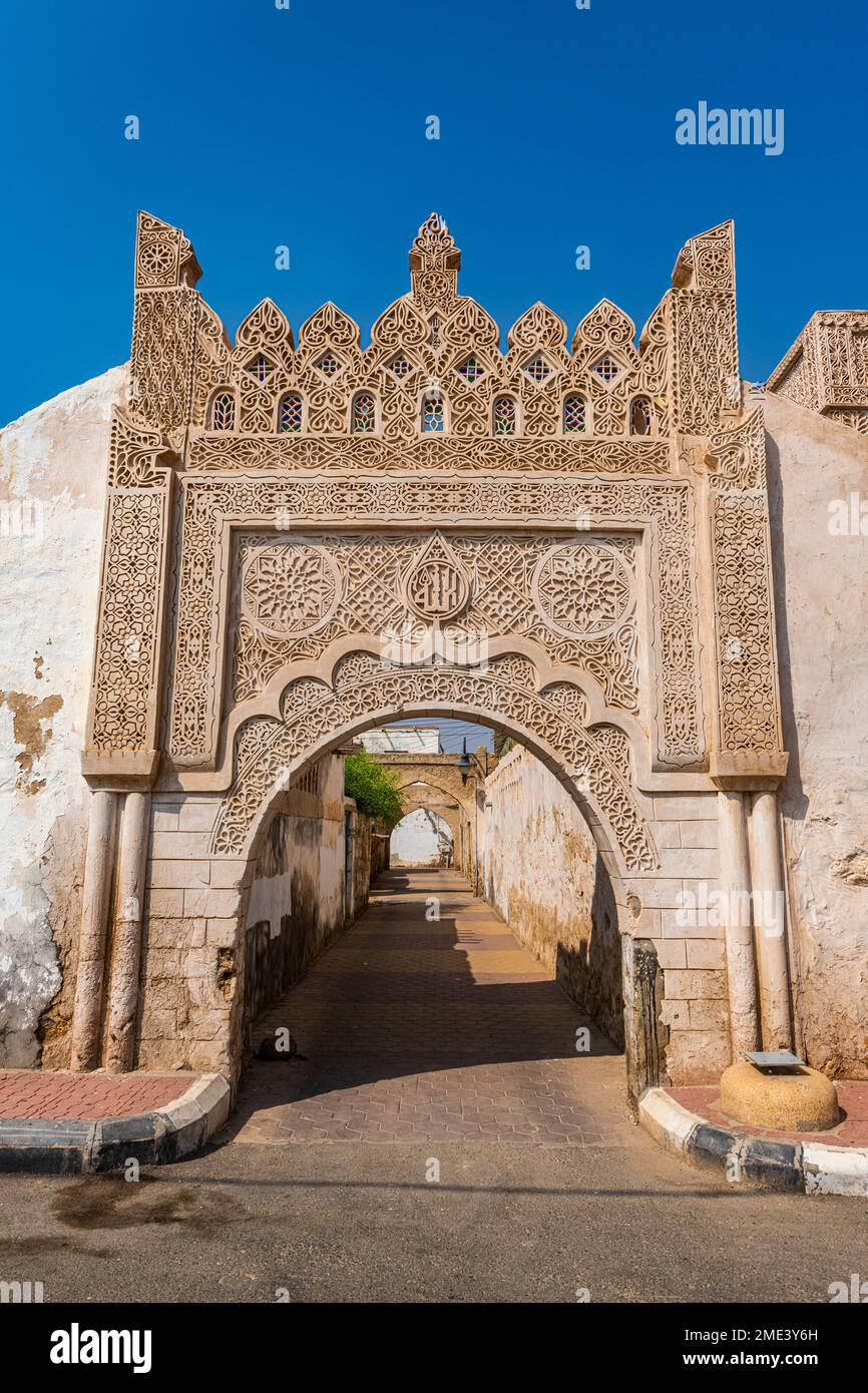 Saudi Arabia, Jazan Province, Ornate arch over empty alley Stock Photo