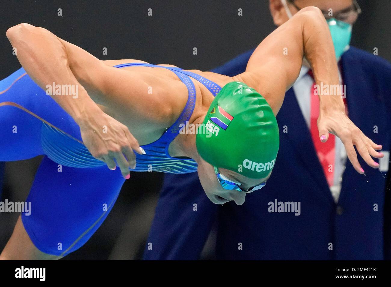 Tatjana Schoenmaker, of South Africa, dives in for the final of the women