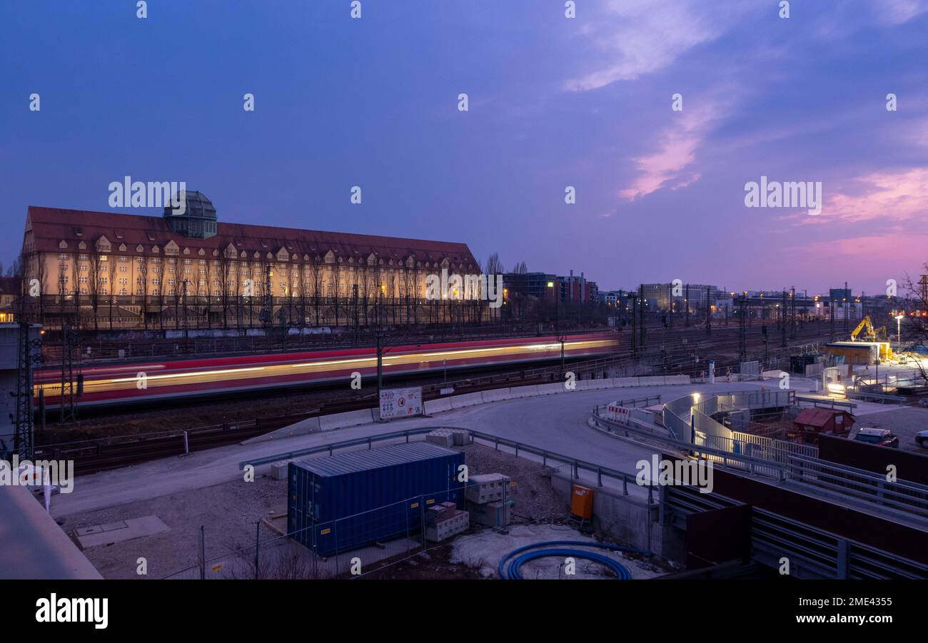 Germany, Bavaria, Munich, Moving train seen from Donnersbergerbrucke at dusk Stock Photo