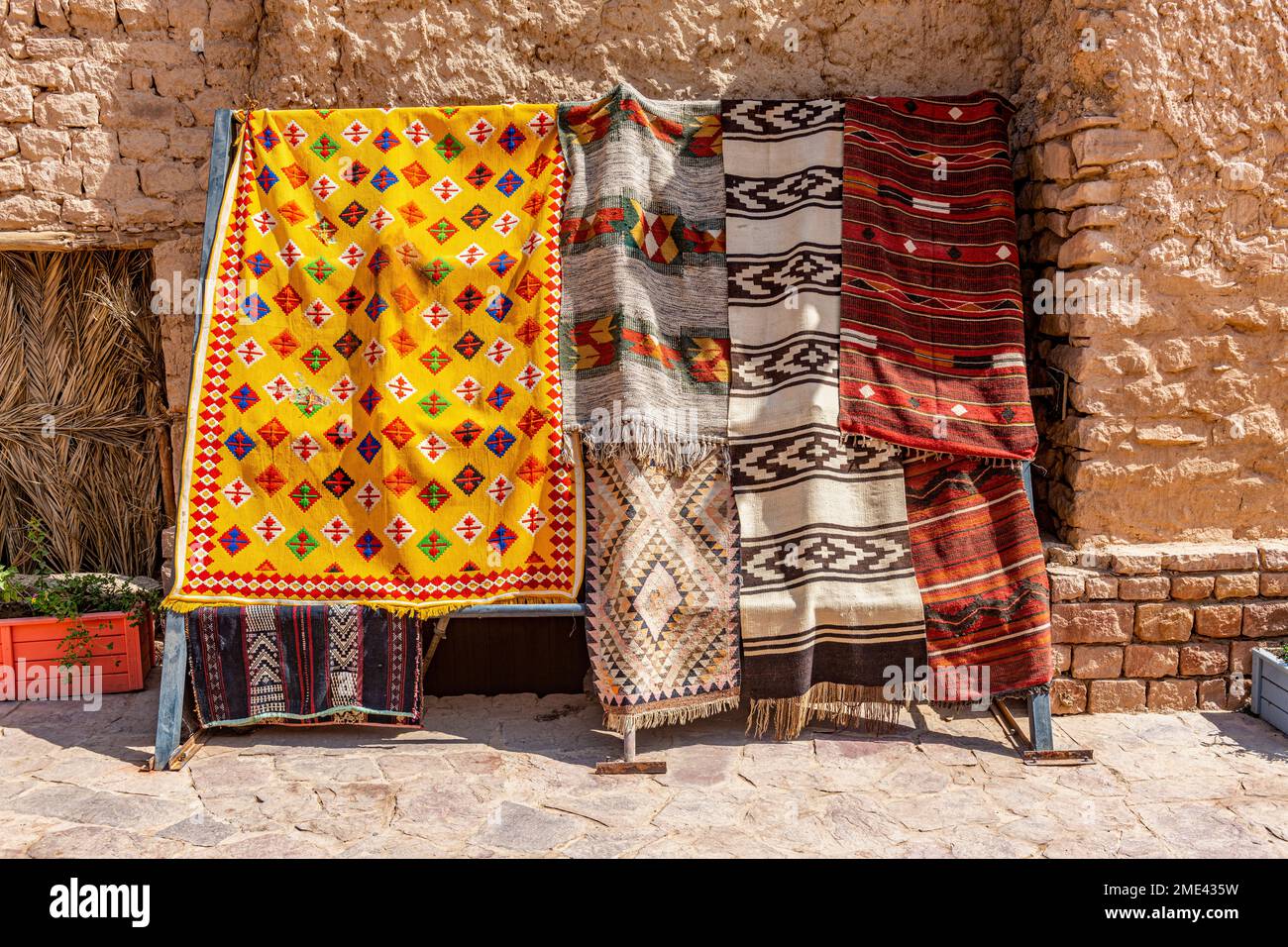 Saudi Arabia, Al-Ula, Arabic rugs hanging outdoors Stock Photo