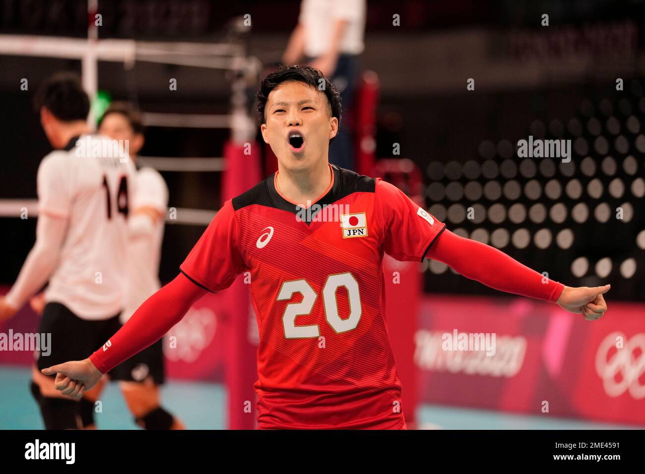 Japan's Tomohiro Yamamoto celebrates a point during a men's volleyball