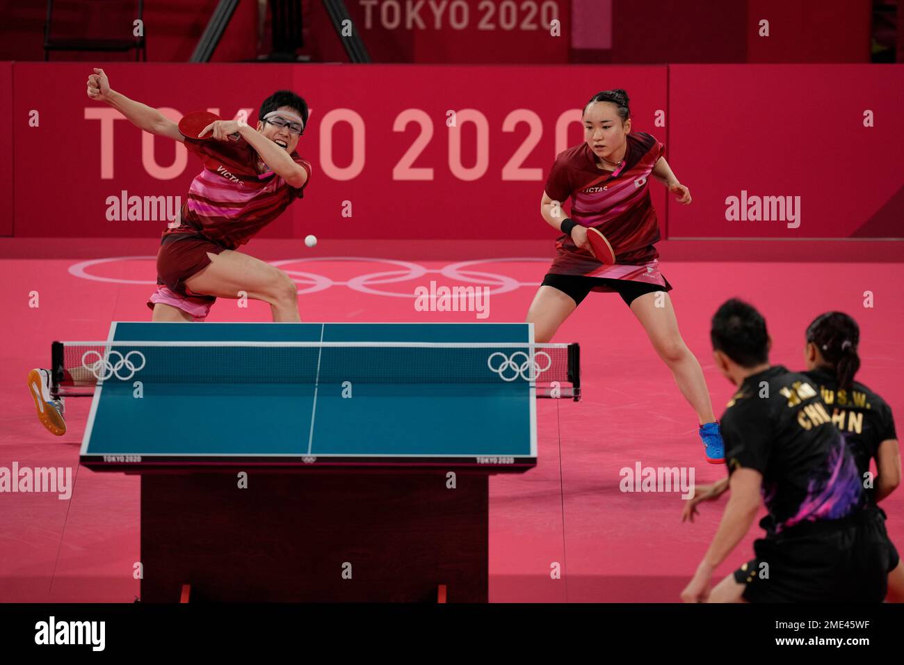 Japan's Mima Ito, left, and Jun Mizutani compete during the table