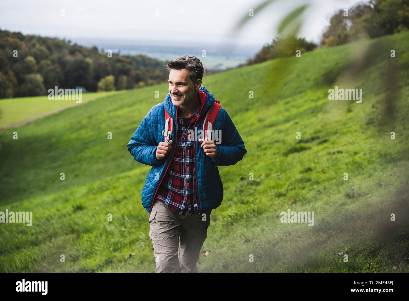 Man walking backpack hi-res stock photography and images - Alamy