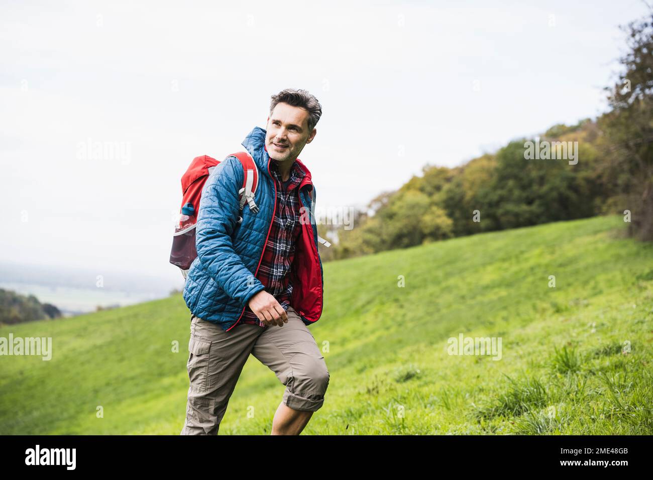 Man walking sky grass hi-res stock photography and images - Alamy