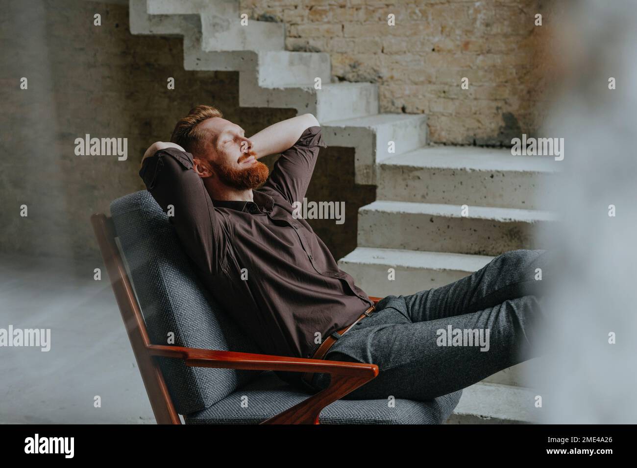 Resting In Chair Happy businessman resting in chair at under construction site Stock ...