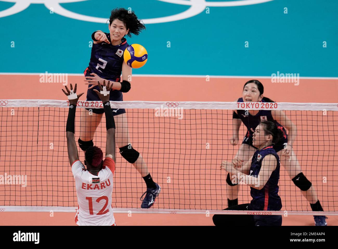 Japan's Sarina Koga spikes the ball against Kenya's Gladys Ekaru