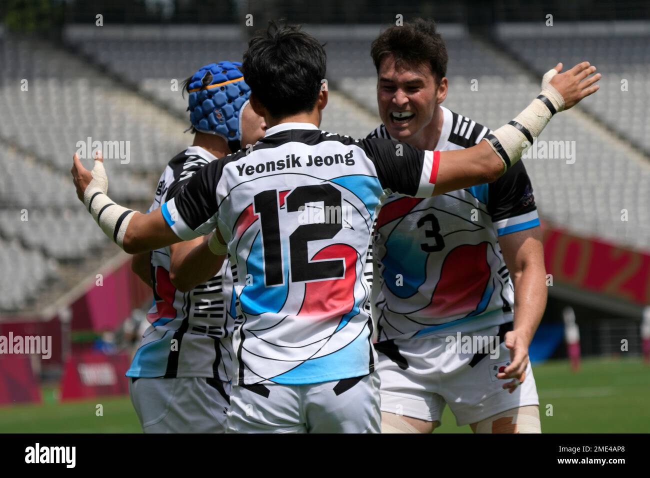 South Korea's Jeong Yeonsik, center, celebrates with teammate Coquillard Andre Jin, after Jeong