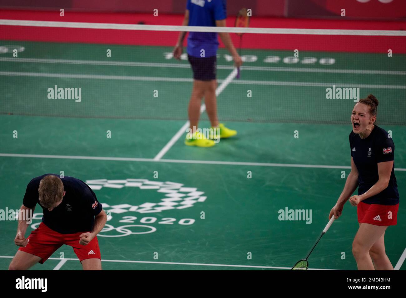 Britain's Marcus Ellis and Lauren Smith play celebrate their victory over  Thailand's Dechapol Puavaranukroh and Sapsiree Taerattanachai during their  mixed doubles group play stage badminton match at the 2020 Summer Olympics,  Monday,