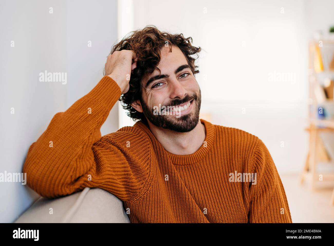 Young happy man sitting home hi-res stock photography and images - Alamy