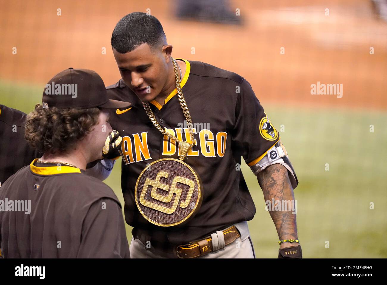 San Diego Padres' Manny Machado wears the home run chain after hitting a  solo home run during the second inning of a baseball game against the Miami  Marlins, Sunday, July 25, 2021
