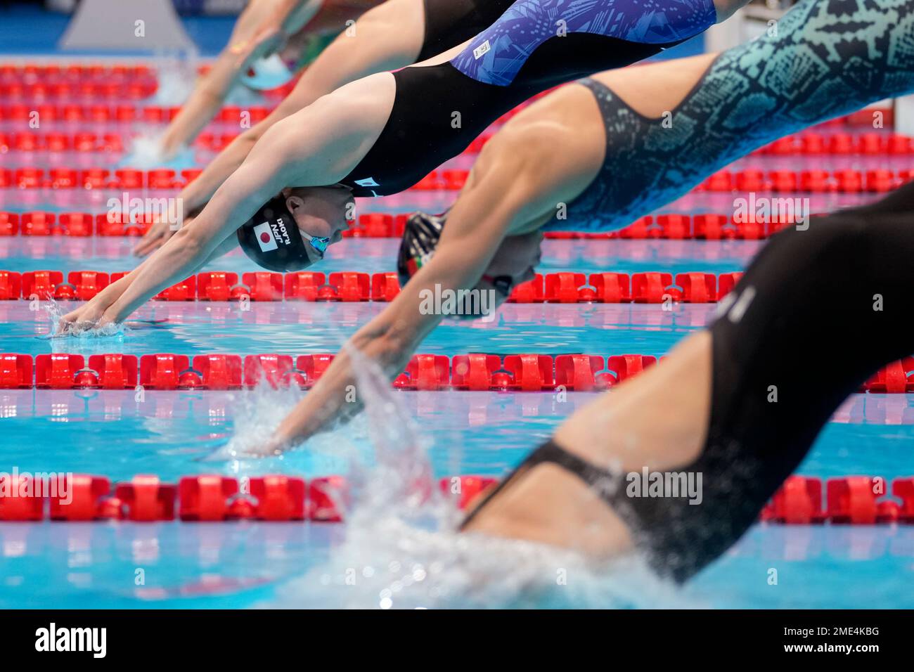 Reona Aoki of Japan, left, starts in her heat of the women