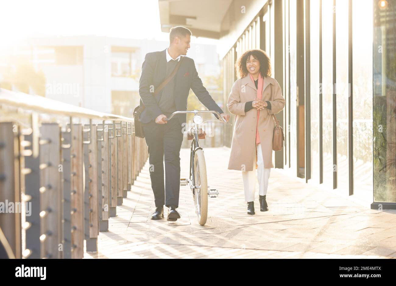Business couple, bicycle and walking outdoor in urban city for freedom, relax conversation and travel commute. Businessman, woman smile and happy Stock Photo