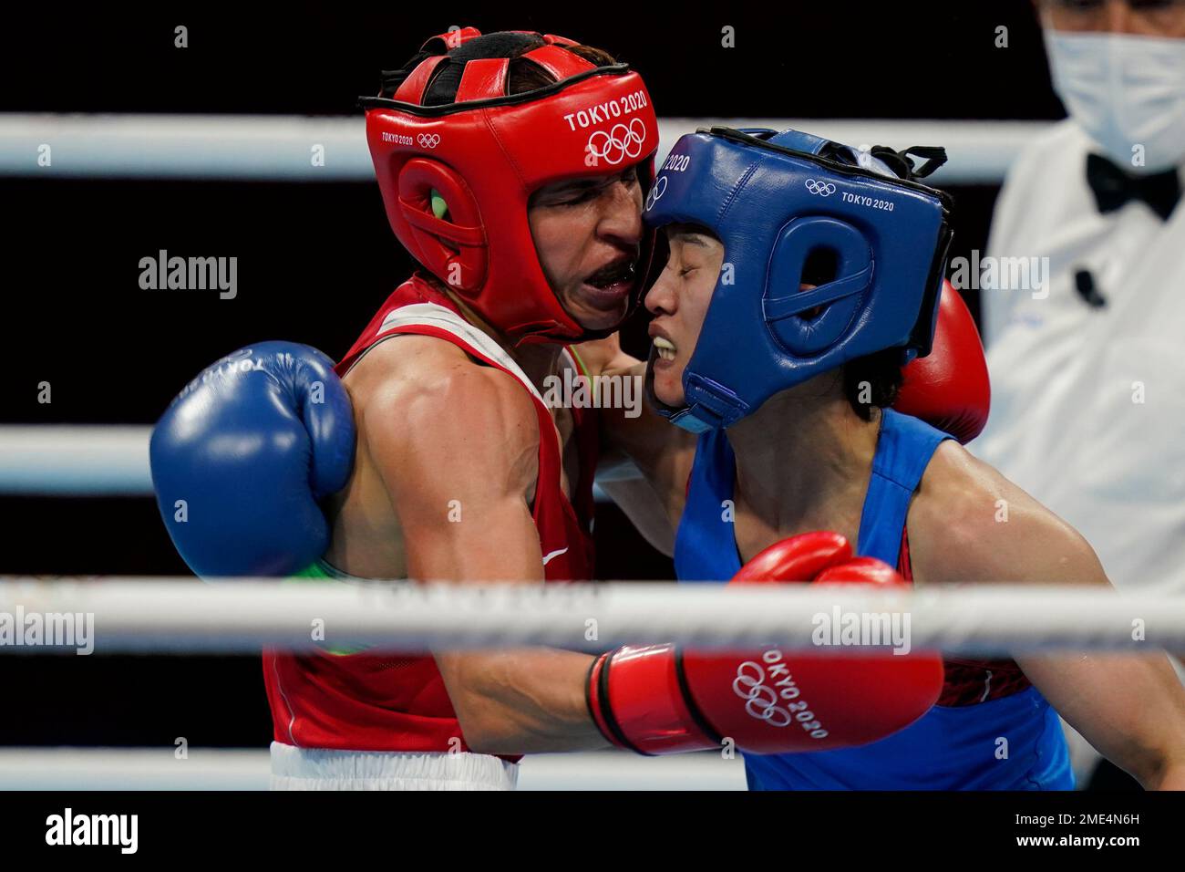 Bulgaria's Stoyka Zhelyazkova Krasteva, left, exchanges punches with