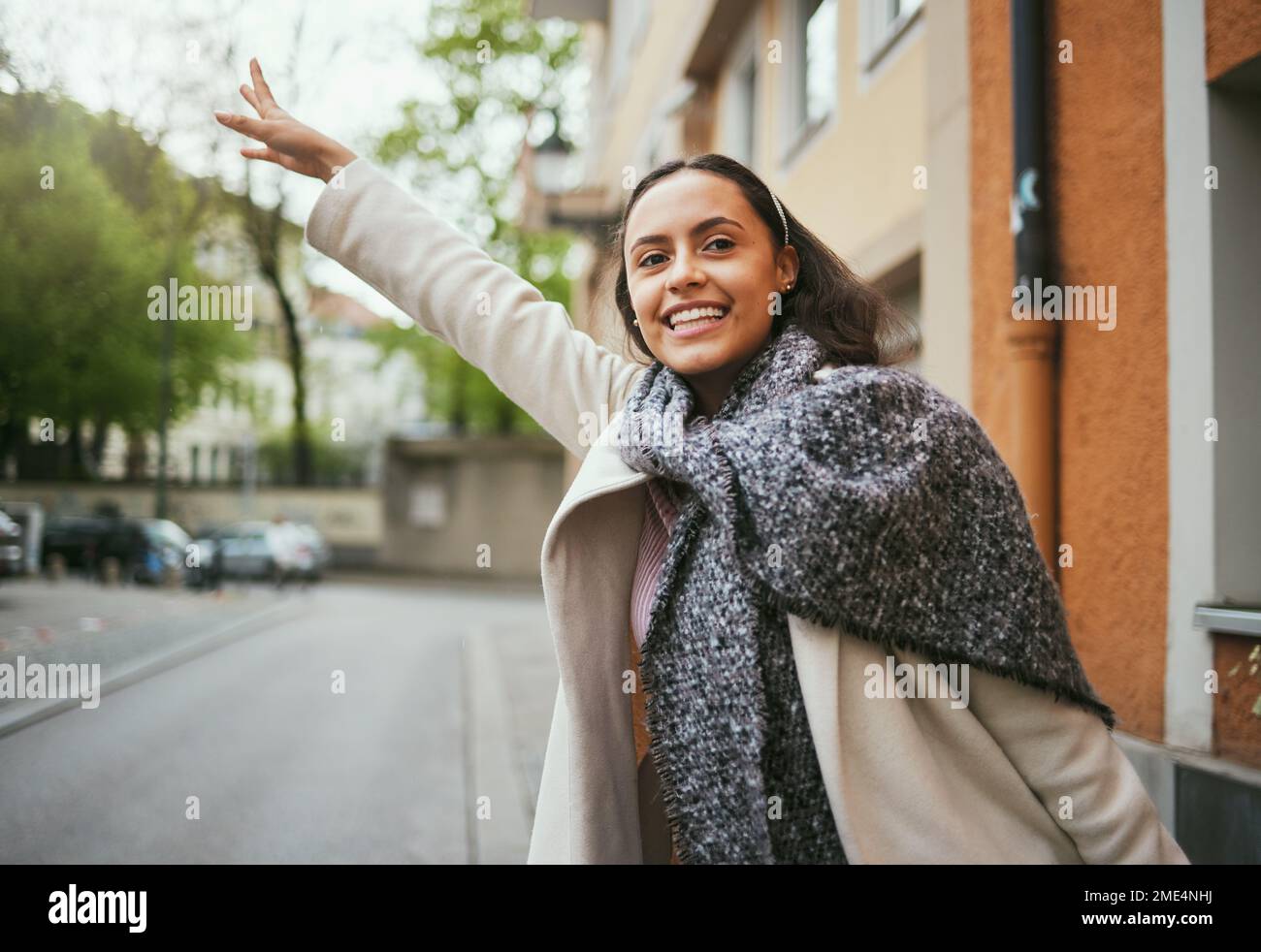 Woman, travel and hailing taxi hand in city, street or New York road in transportation, traveling and commute. Happy tourist, student and person Stock Photo