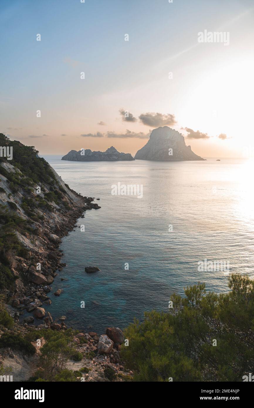 Spain, Balearic Islands, Seashore at sunset with Es Vedra island in background Stock Photo