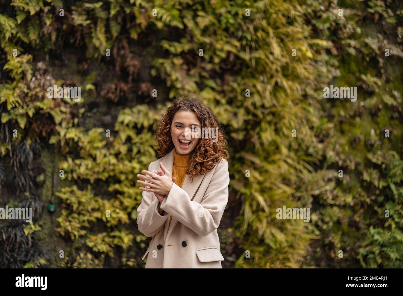 Woman clapping hands in park hi-res stock photography and images - Alamy