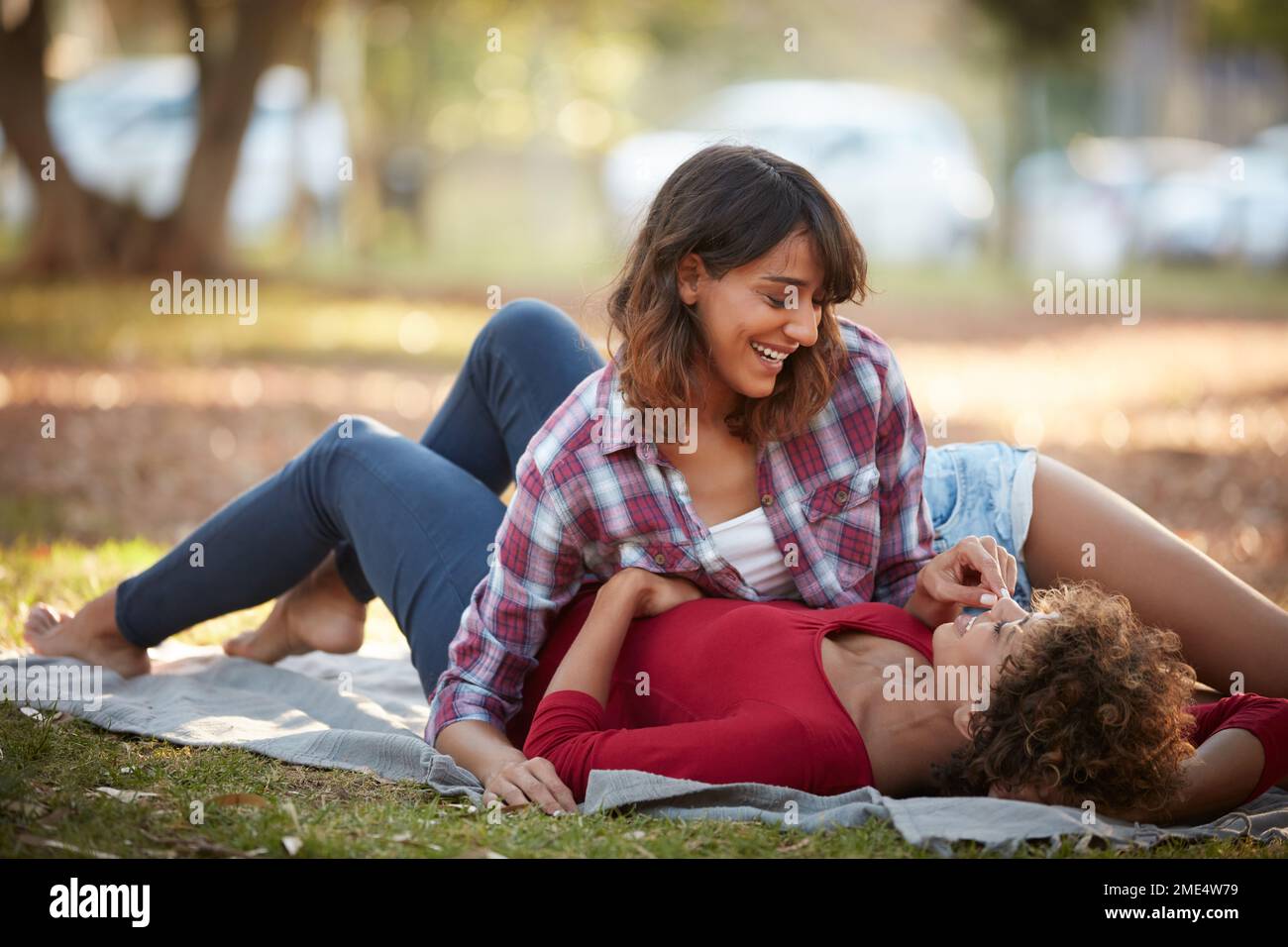 I think youre amazing. a young couple spending the day outdoors on a sunny day. Stock Photo