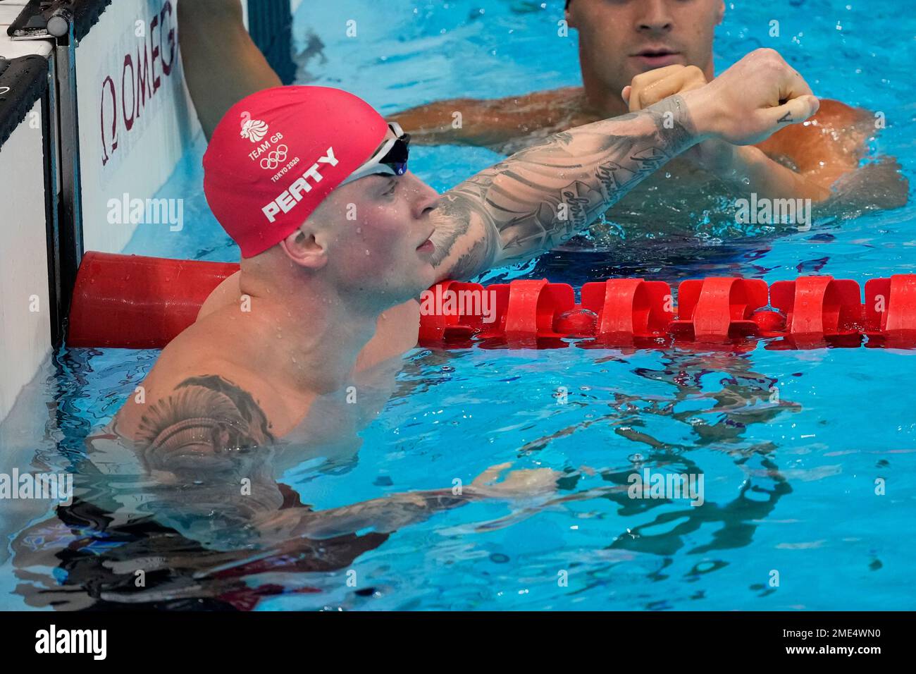Adam Peaty, of Great Britain, reacts after a semifinal in the men