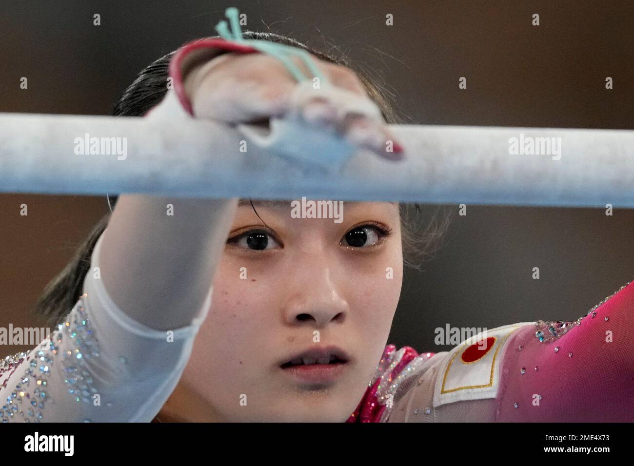 Yuna Hiraiwa, of Japan, performs on the uneven bars during the women's