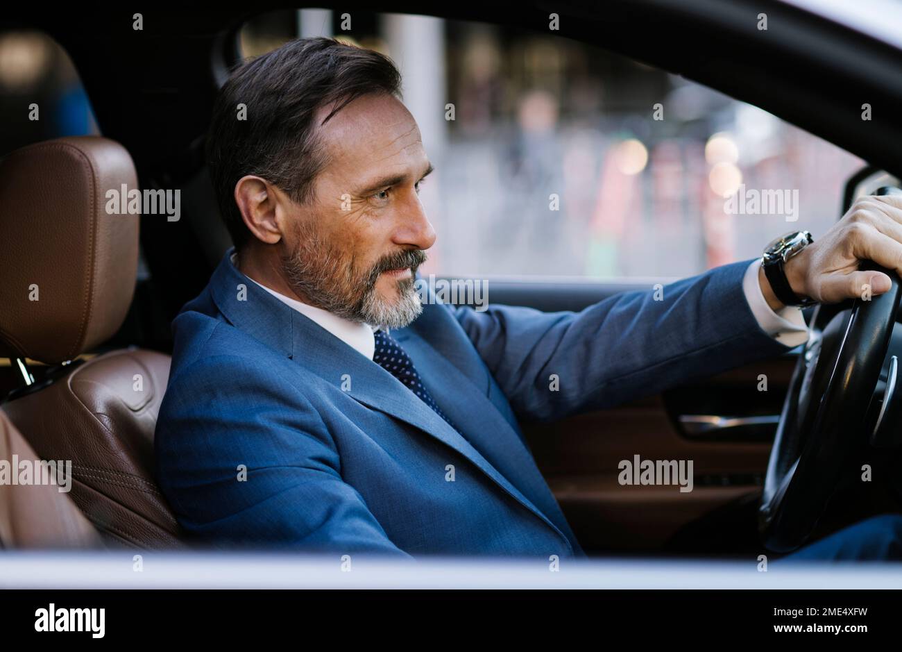Businessman car smiling steering wheel hi-res stock photography and ...