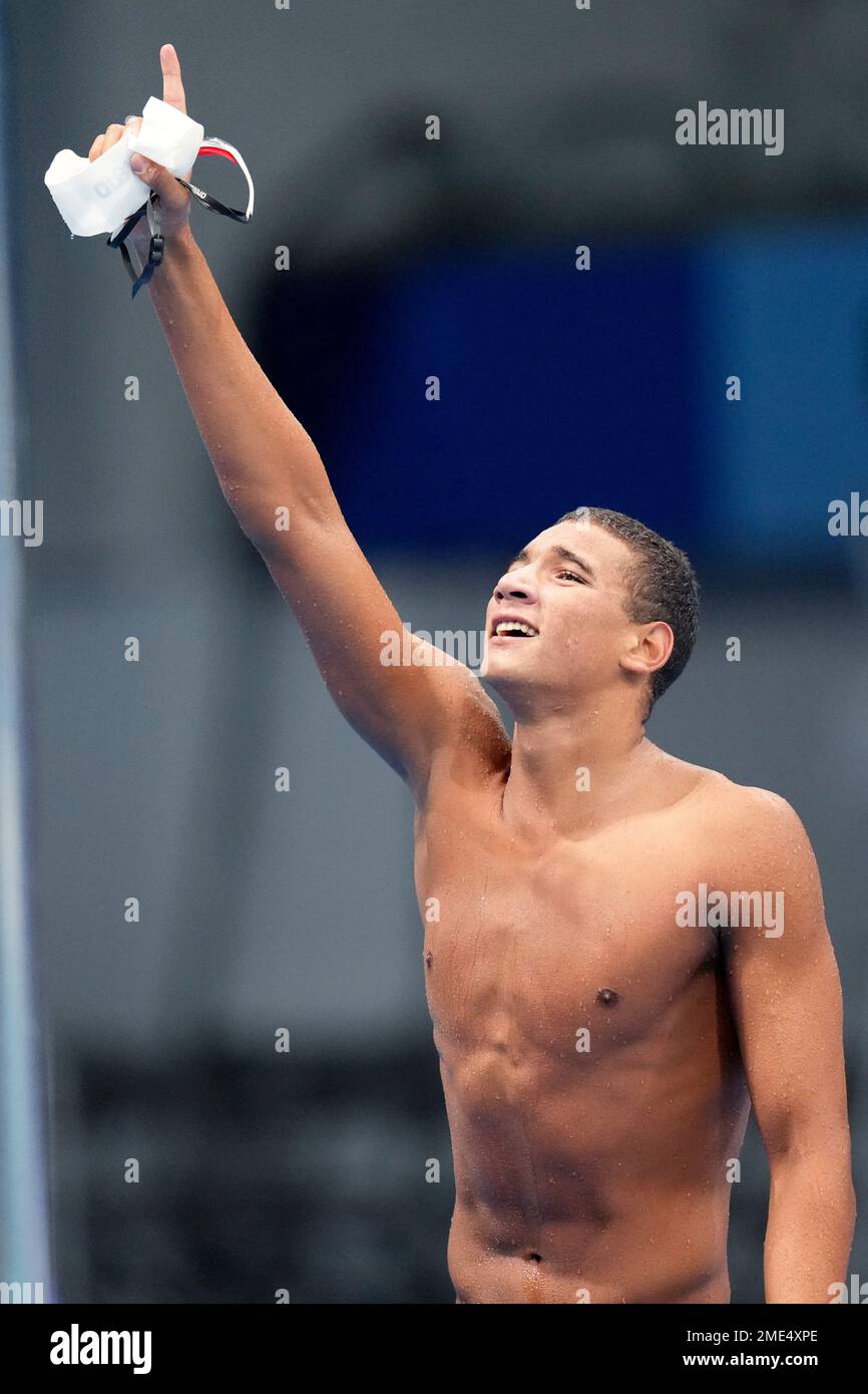 Ahmed Hafnaoui, of Tunisia, reacts after winning the final of the men's