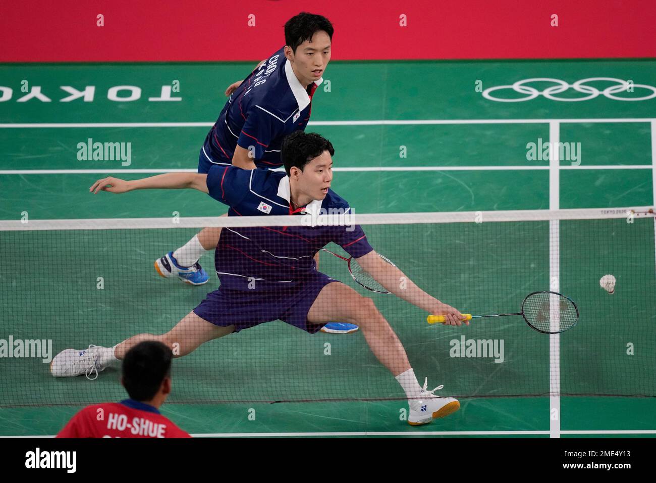 South Korea's Choi Sol-gyu, top, and Seo Seung-jae play against Canada's  Jason Ho-Shue and Nyl Yakura during their men's doubles badminton match at  the 2020 Summer Olympics, Sunday, July 25, 2021, in