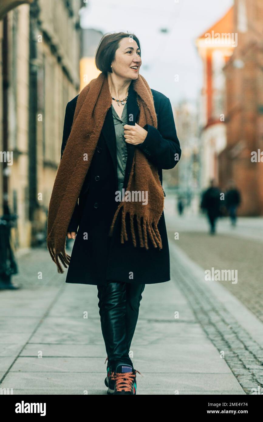 Mature woman happy winter vertical hi-res stock photography and images ...