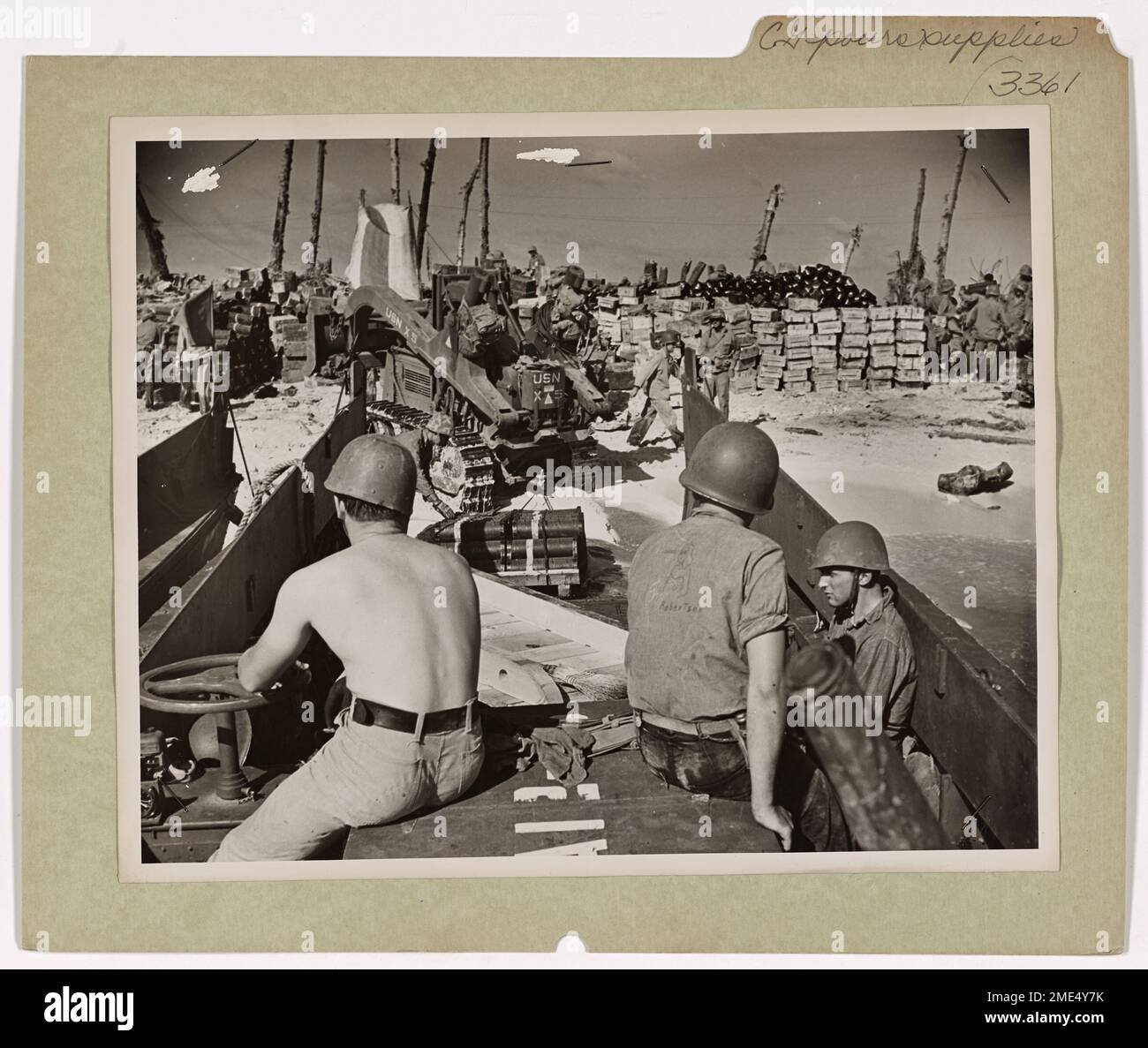 Coast Guard Pours Supplies Into Eniwetok. Mountains of supplies rise on