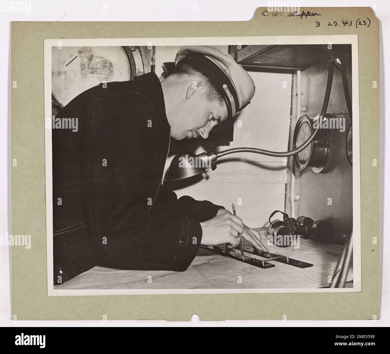 Coast Guard Skipper Checks His Course on the Chart. Coast Guard Skipper
