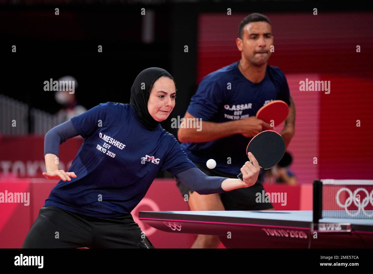 Egypt's Omar Assar, right, and Dina Meshref compete during table tennis ...