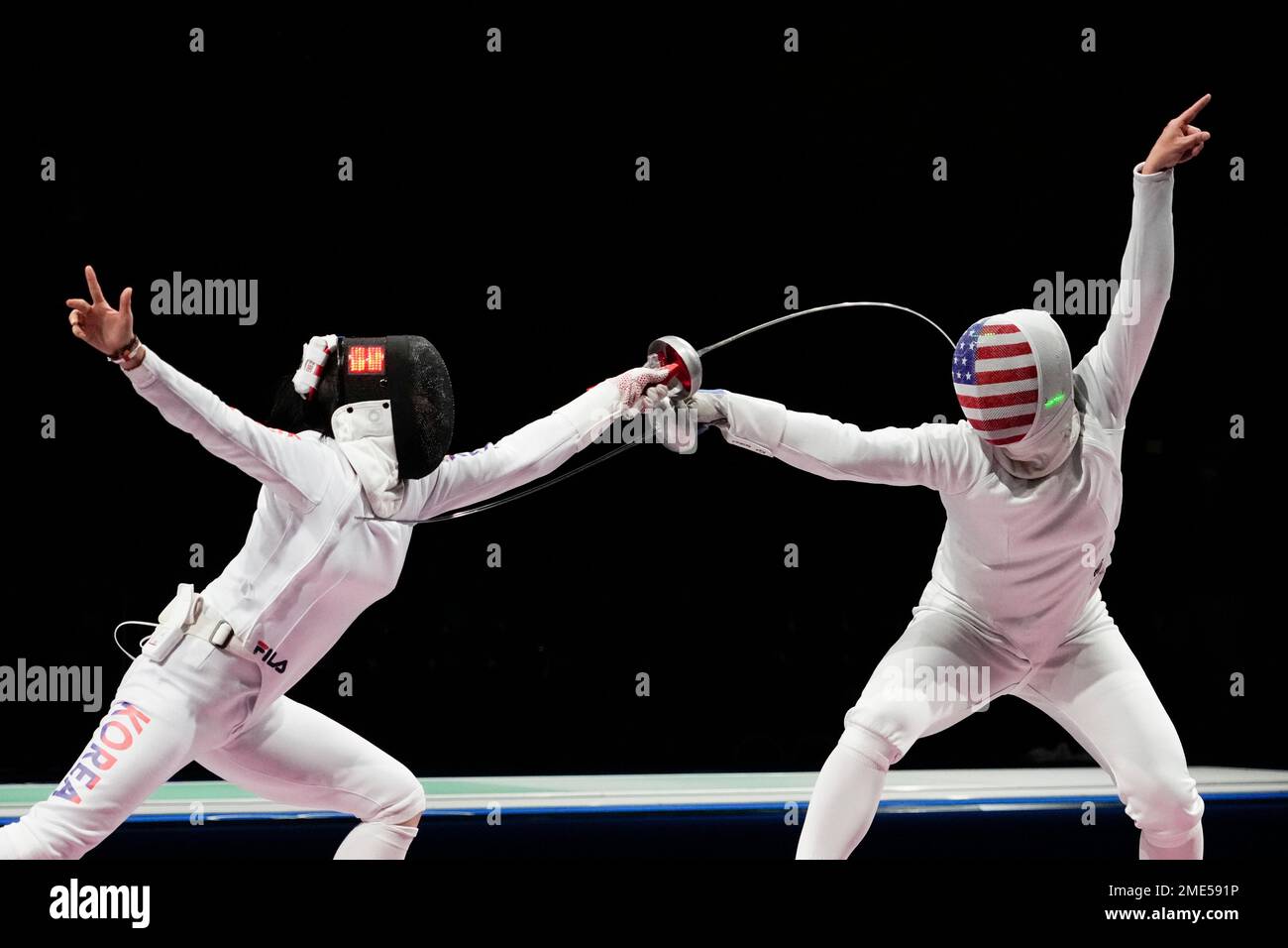 https://c8.alamy.com/comp/2ME591P/song-sera-of-south-korea-left-and-katharine-holmes-of-the-united-states-compete-in-the-womens-individual-epee-round-of-32-competition-at-the-2020-summer-olympics-saturday-july-24-2021-in-chiba-japan-ap-photoandrew-medichini-2ME591P.jpg
