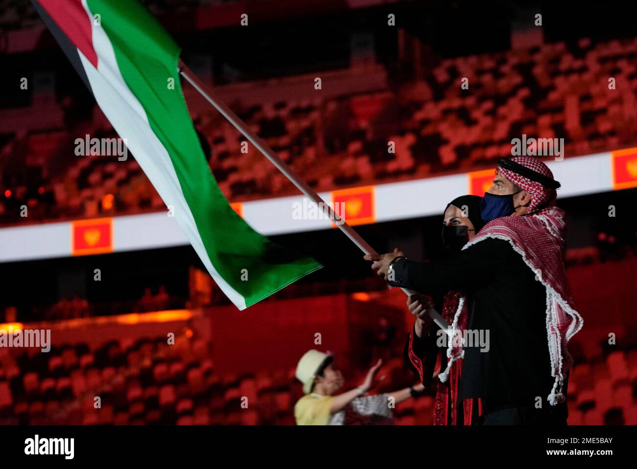 Julyana AlSadeq and Zeyad Eishaih Hussein Eashash, of Jordan, carry