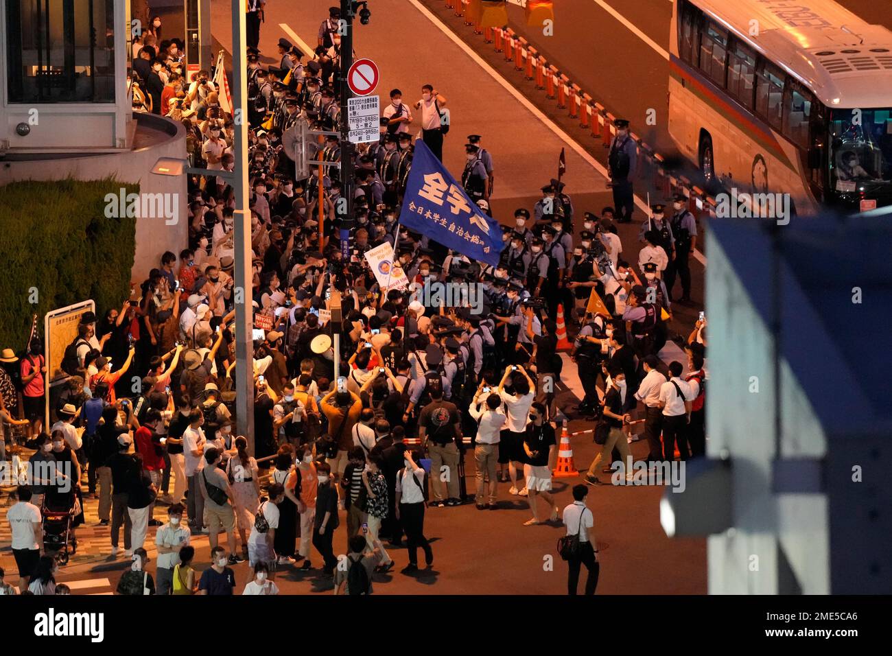 Protesters against the 2020 Summer Olympics gather outside the National