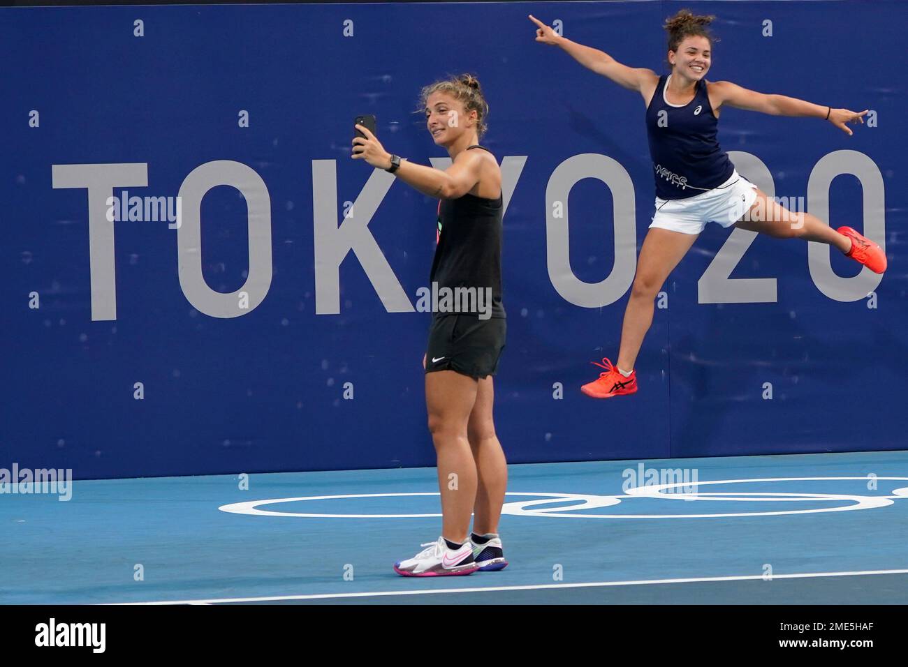 Italian tennis players Jasmine Paolini, right, and Sara Errani pose for pictures at the Ariake