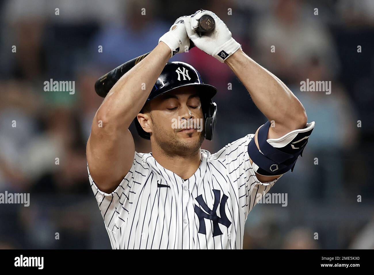 New York Yankees' Giancarlo Stanton reacts to popping out against