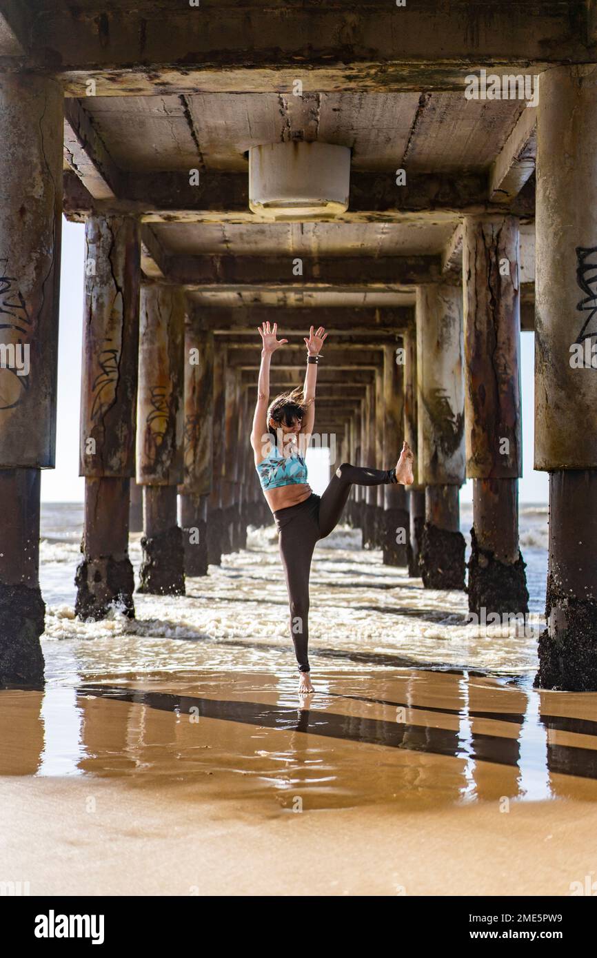 Beautiful woman dancing beach hi-res stock photography and images - Alamy