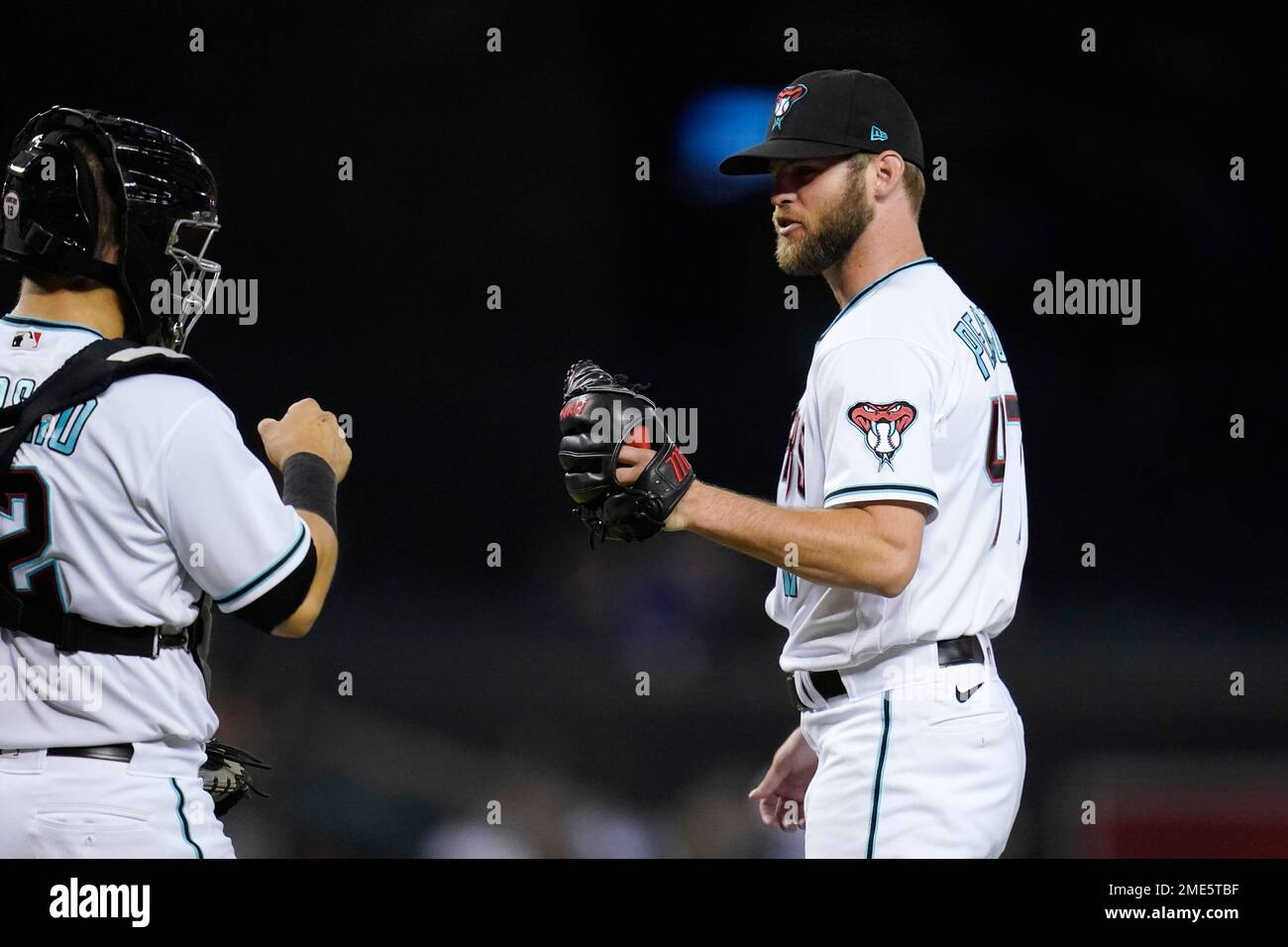 Arizona Diamondbacks relief pitcher Matt Peacock, right, celebrates with catcher Daulton Varsho after the final out in of the teams baseball game against the Pittsburgh Pirates, Tuesday, July 20, 2021, in Phoenix.