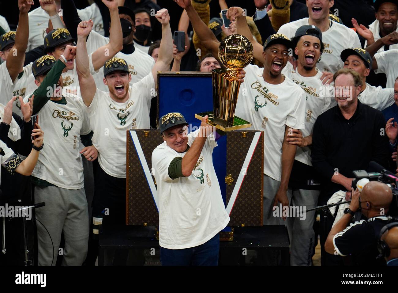 Milwaukee Bucks co-owner Marc Lasry holds up the championship trophy after  they defeated the Phoenix Suns in Game 6 of basketball's NBA Finals in  Milwaukee, Tuesday, July 20, 2021. (AP Photo/Paul Sancya