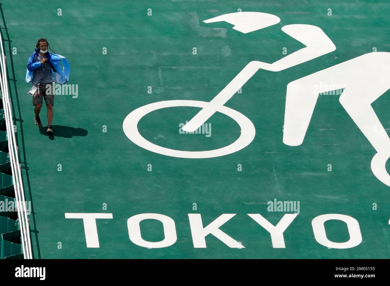 A worker runs down the start ramp at the BMX racing track as ...