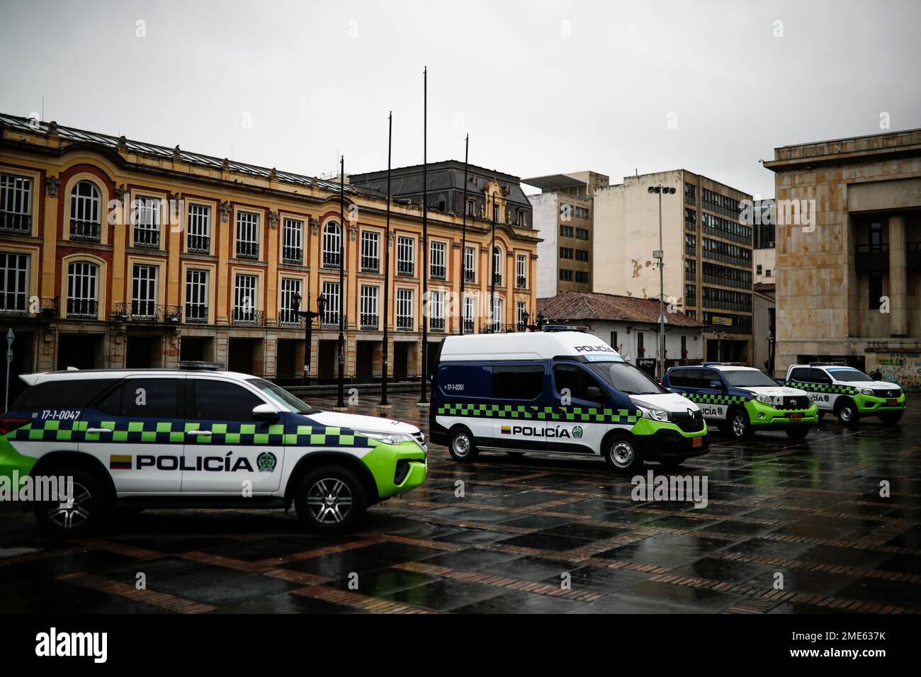 National Police cars are parked in Plaza de Bolivar for a ceremony